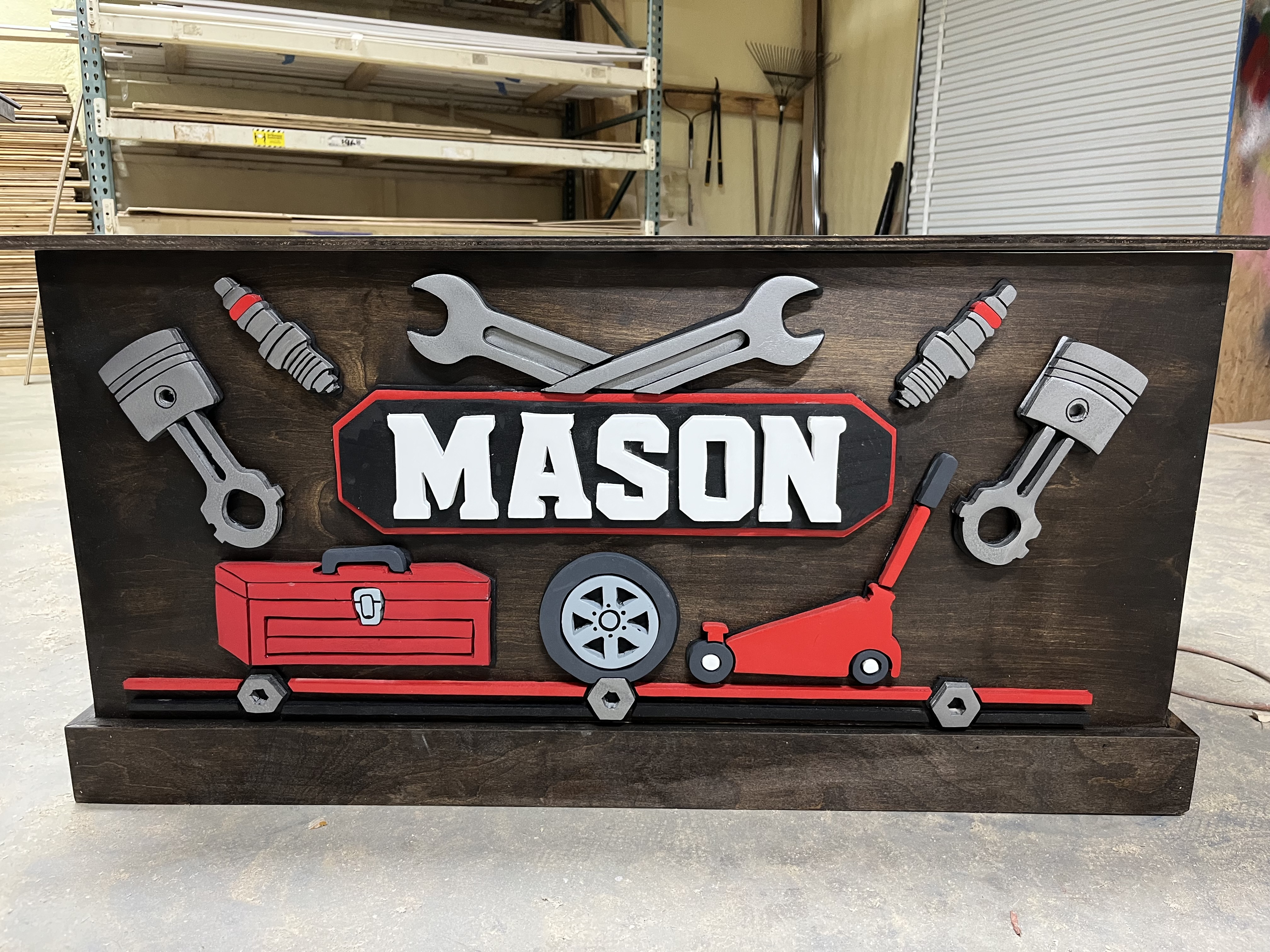 Mechanic themed wooden toy box with hand-painted pistons and wrenches
