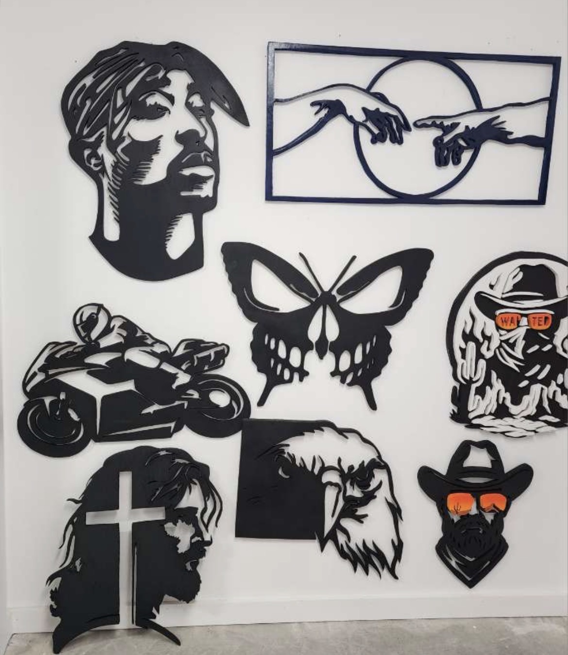 A wall of finished hand-cut signs at a local show